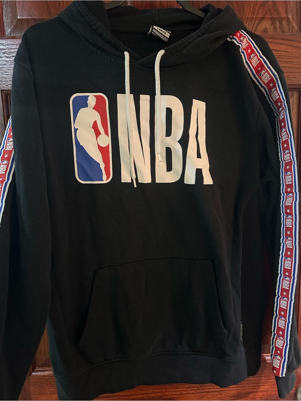 NBA Men's Black Zip-Up Hoodie with White Logo and Red/Blue Sleeve Trim